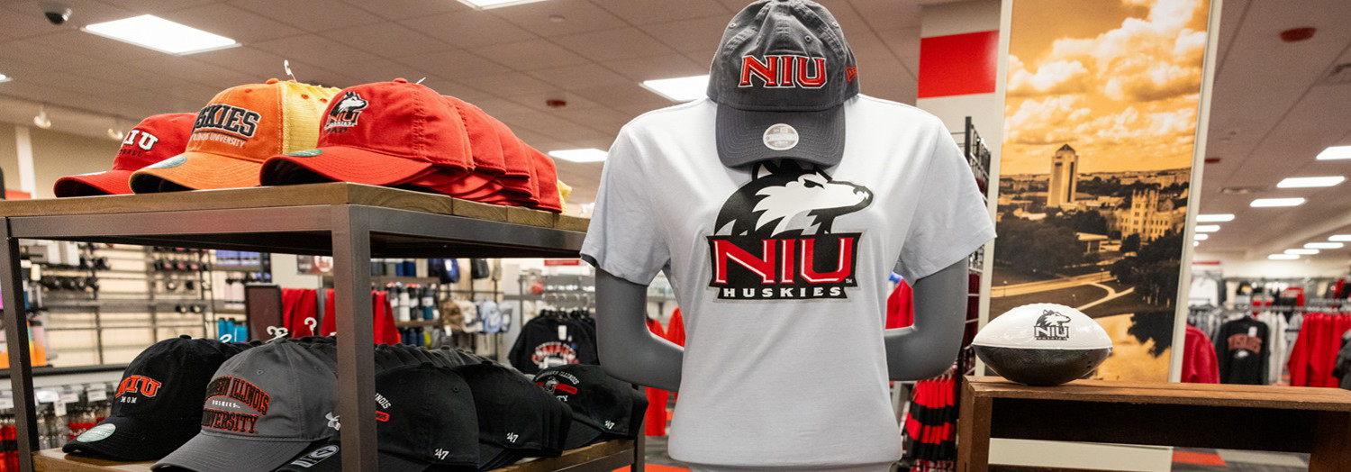Huskie Books and gear display of NIU t-shirts and hats